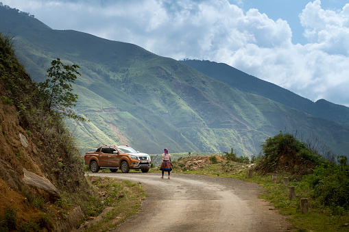 Ta Xua commune, Son La province , Vietnam - May 20, 2018: A female tourist to experience the life of ethnic minority H'Mong in Ta Xua commune, Son La province, Vietnam