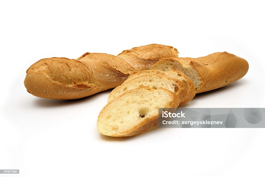 Fresh baguette, sliced, isolated on white background  Baguette Stock Photo