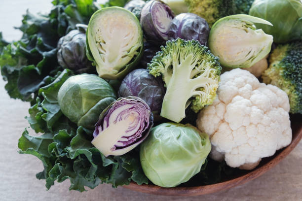 istock cruciferous vegetables, cauliflower,broccoli, Brussels sprouts, kale in wooden bowl, reducing estrogen dominance, ketogenic diet 978773852