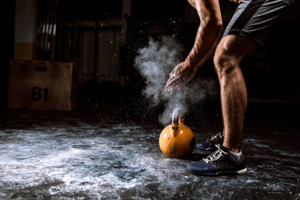 Young Man Putting On Sports Chalk For Lifting Barbell Part Of Unrecognizable Handsome Athlete Man Preparing To Lift Barbell crossfit chalk weightlifting weight training stock pictures, royalty-free photos & images