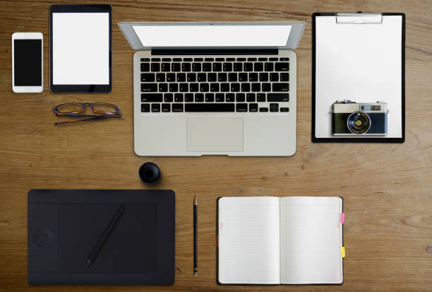 istock Mockup Graphic design device on wooden desk 978776656