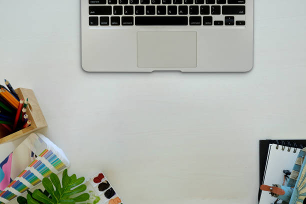 istock Artist workplace with creative craft tools on wooden desk and copy space. 978776894