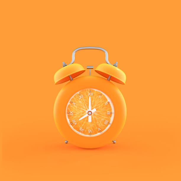 istock Orange alarm clock on orange color background 978776982