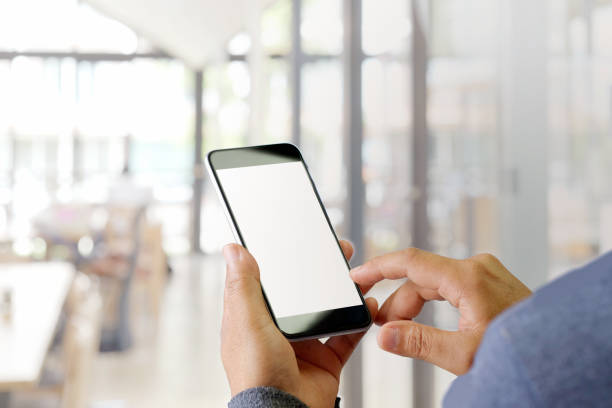 istock Cropped shot of an unrecognizable man using smartphone in cafe. 978777074