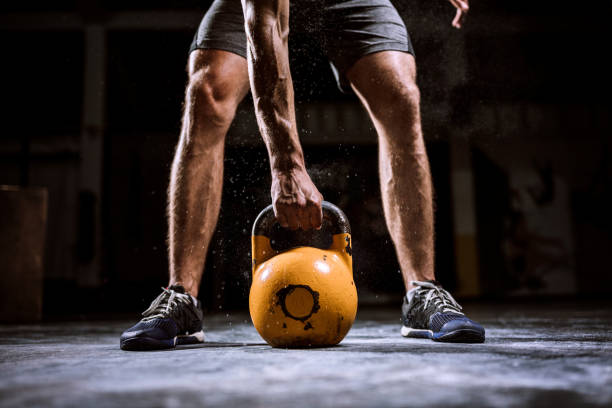 Young Man Preparing For lifting Barbell Part Of Unrecognizable Handsome Athlete Man Preparing To Lift Barbell crossfit chalk weightlifting weight training stock pictures, royalty-free photos & images