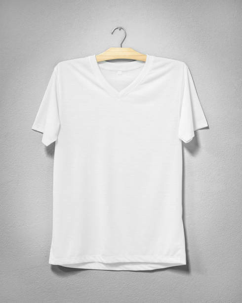 istock White shirt hanging on cement wall. Empty clothing for design. Front view. 978777478