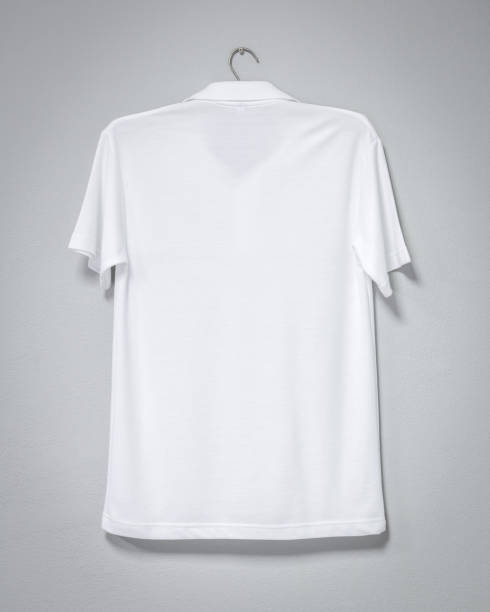 istock White shirt hanging on cement wall. Blank t-shirt for printing. Back view. 978777566