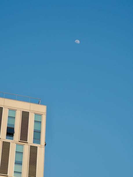 istock The blue sky and the moon and the building 978777768