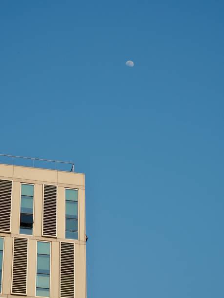 istock The blue sky and the moon and the building 978777772