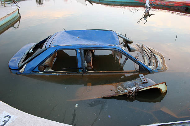 istock Old broken car submerged in water 97878861