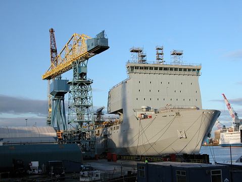 A Royal Navy ship being built at a shipyard in Newcastle upon Tyne, UK.