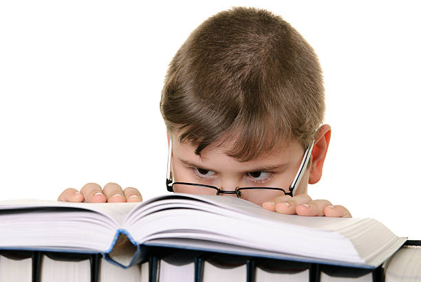 istock Boy in glasses with the book 97888534