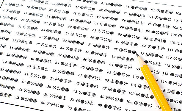 Optical answer sheet with bubbles shaded in pencil stock photo