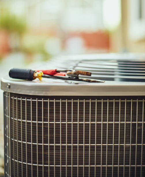 istock Air conditioner with maintenance tools in residential back yard 978892602
