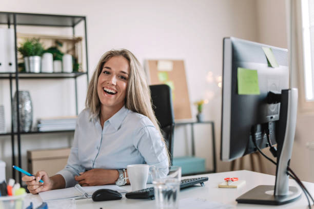 istock Businesswoman taking a note in her office 978894946