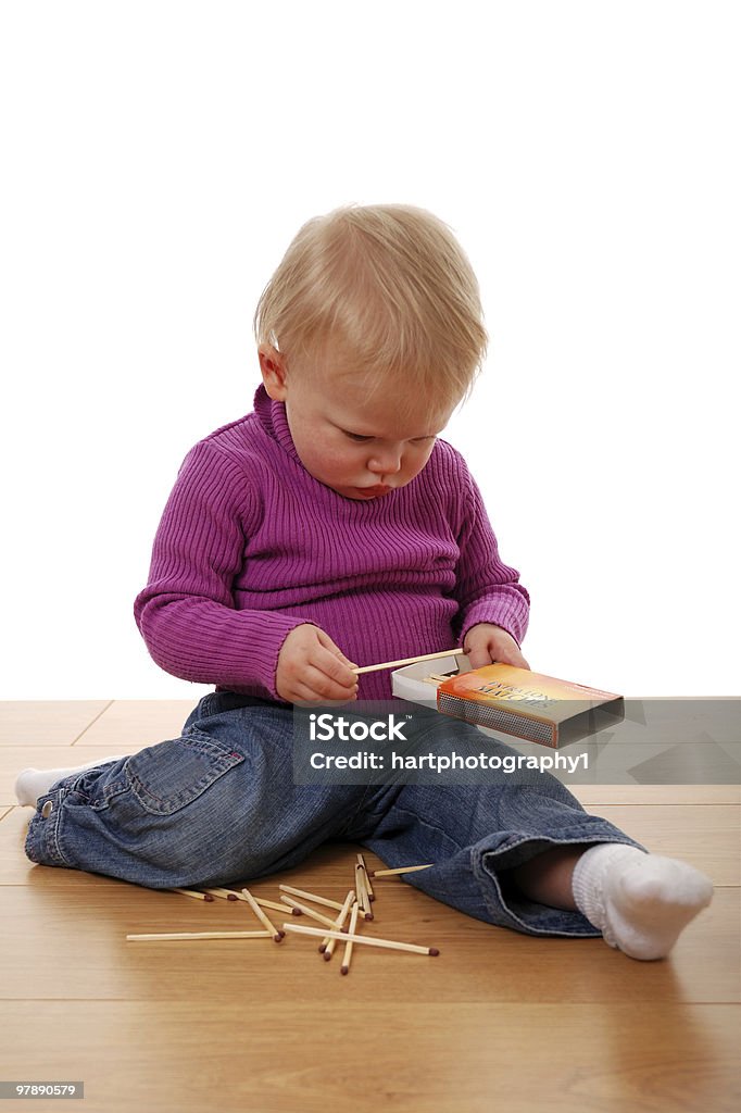 Playing with fire  Baby - Human Age Stock Photo
