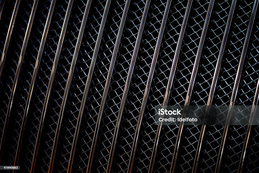 Close-up of the dark colored grill of a car Closeup image of a metal car grill. Car Stock Photo