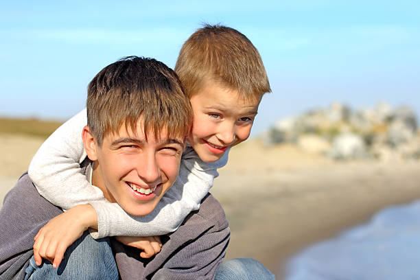 istock happy teenager and kid 97891173