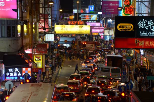 istock Crowded street in Mong Kok district by night, Hong Kong 978916572