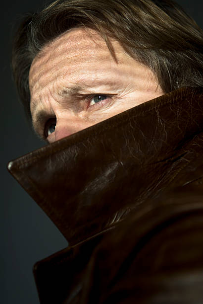 mystery man in coat stock photo