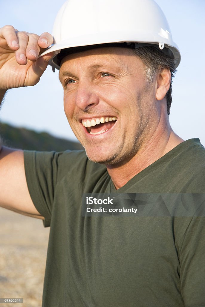 幸せな笑顔の建設作業員 - 中年の男性のロイヤリティフリーストックフォト