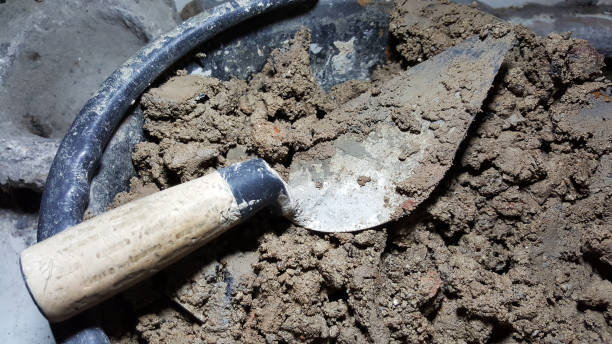 istock trowel on soil tub, mortar concrete interior 978939162