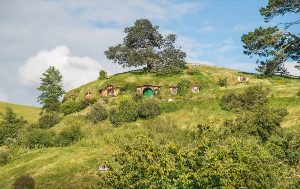 The Bag End an iconic famous Hobbiton holes (Bilbo & Frodo house) in Hobbiton movie set in Matamata, New Zealand. Matamata, New Zealand - December 09 2017 : The Bag End an iconic famous Hobbiton holes (Bilbo & Frodo house) in Hobbiton movie set in Matamata, New Zealand. matamata new zealand stock pictures, royalty-free photos & images