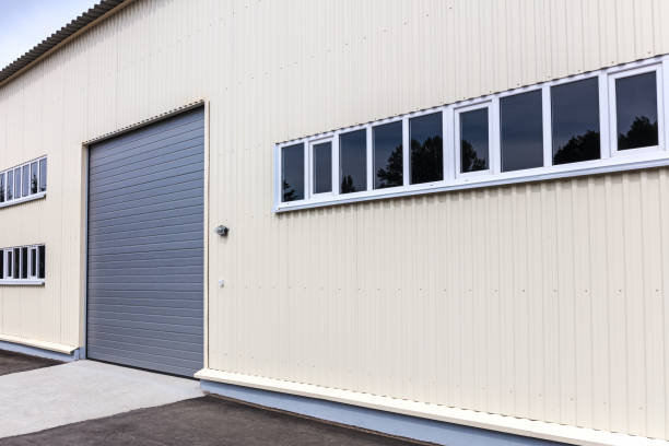 istock new storehouse building wall with closed gate 978945414