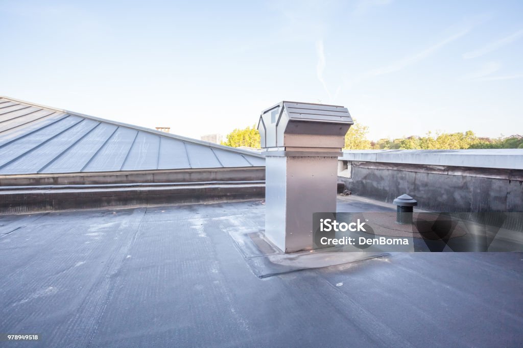 cooling on a flat roof on a high building in the city there is cooling on a flat roof Rooftop Stock Photo