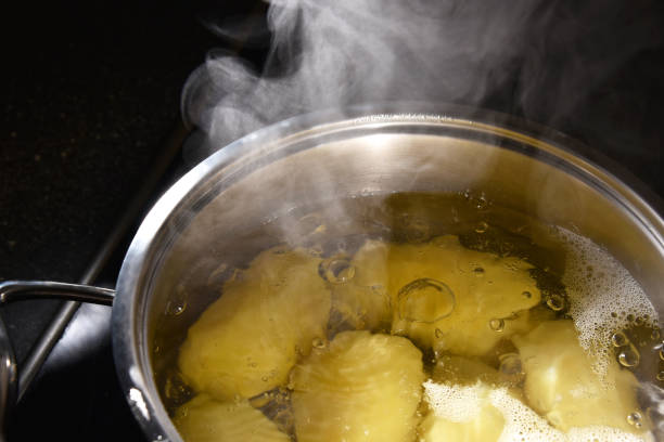 istock Potatoes boil in a saucepan on the stove 978955838