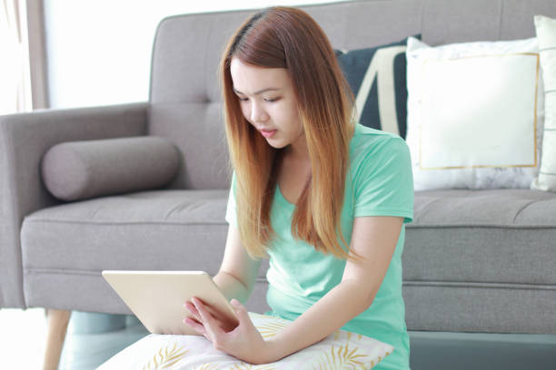 istock Young woman wearing virtual reality glasses at home. 978958170