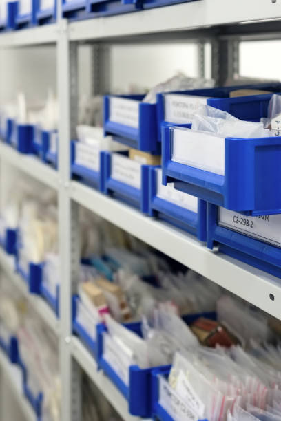 istock Blue plastic trays in metal racks 978961684