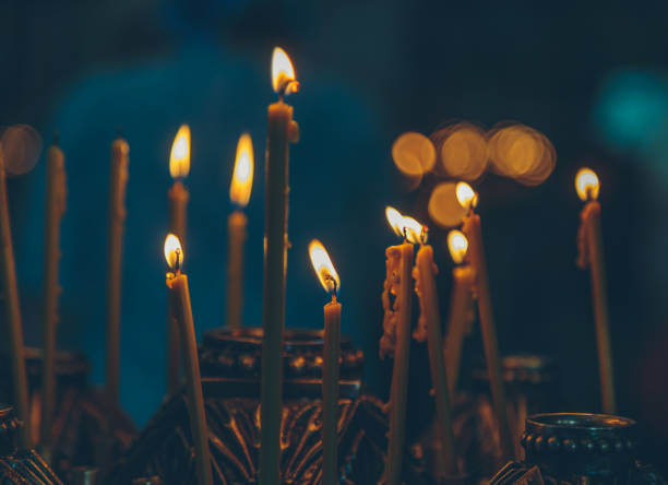 istock lighted candles in the church 978964138