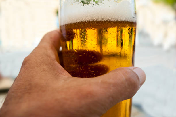 Glass of beer in the hand