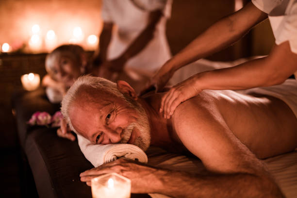 istock Senior couple having a relaxing massage at the beauty spa. 978969310