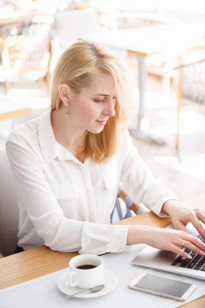 istock Beautiful young woman working in morning time 978969348