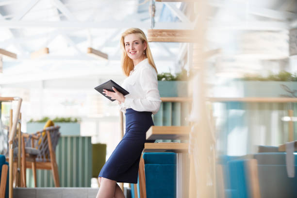 istock Beautiful young woman working in morning time 978975300