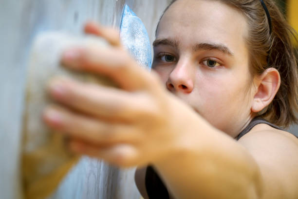 istock Teenage Boy Training Climbing On Indoor Climbing Wall 978978794