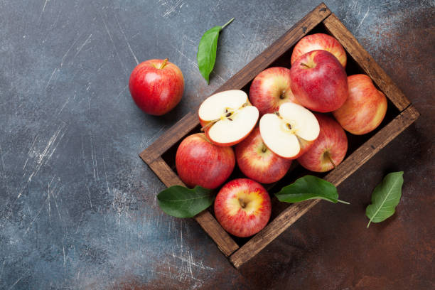 istock Red apples in wooden box 978985696