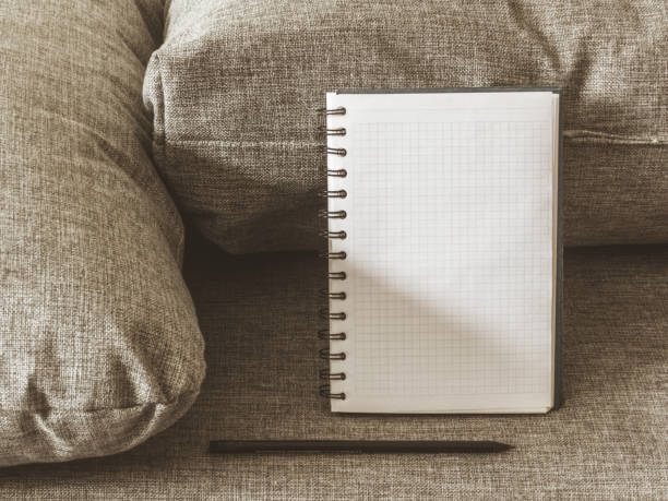 istock Top view goals list with notebook, pencil on grey fabric. Flat lay, copy space 978986046