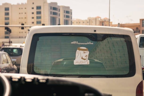 Emir portrait Doha, Qatar - Mart, 2018: Portrait of Qatari Emir - Tamim bin Hamad Al Thani on the back car window. qatar emir stock pictures, royalty-free photos & images
