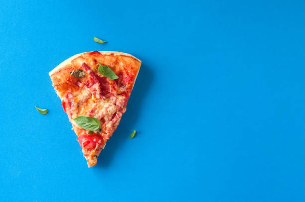 istock Three slices salami mozarella pizza black background. Top view f 978997602