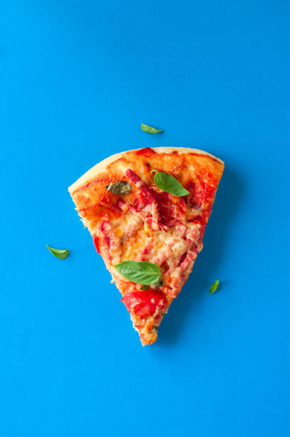 istock Three slices salami mozarella pizza black background. Top view f 978997610