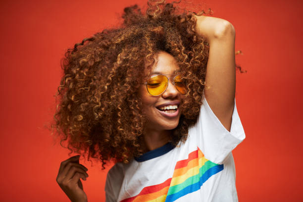 Beautiful young woman with afro, Reggaeton musician. Beautiful young woman with afro hair in summer themes.
Made in Barcelona with model from Venezuela. tropical music stock pictures, royalty-free photos & images