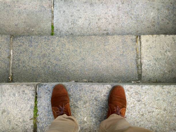 istock Feet on the stairs. 979005558