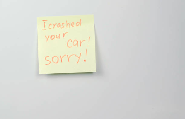 istock Note on yellow sticker paper sheets with words i crashed your car sorry. 979008736