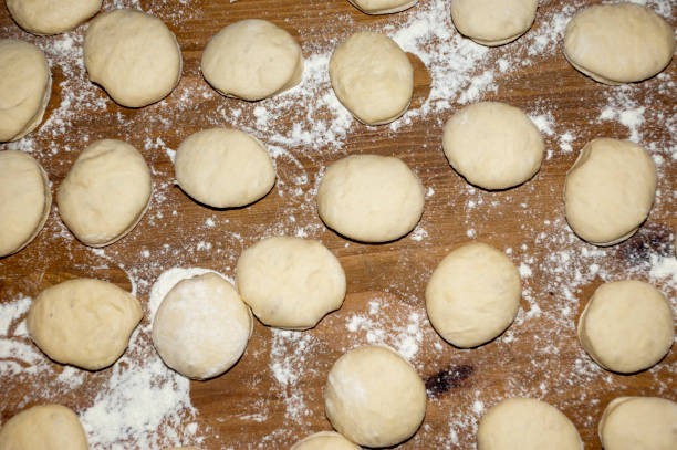 istock Homemade donuts dough on the table 979008824