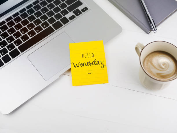 Hello Wednesday text on stick note on work desk Hello Wednesday text on stick note on work desk wednesday morning stock pictures, royalty-free photos & images