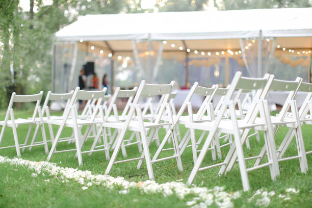istock White chairs in park near restaurant 979016348