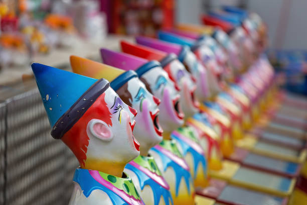 istock Painted Clown Faces On Side Show Alley At Local Show 979016544